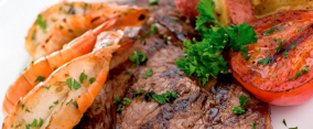Grilled meat and tomatoes cooked by student