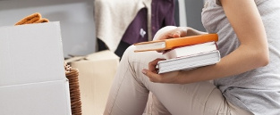 Student packing books for university
